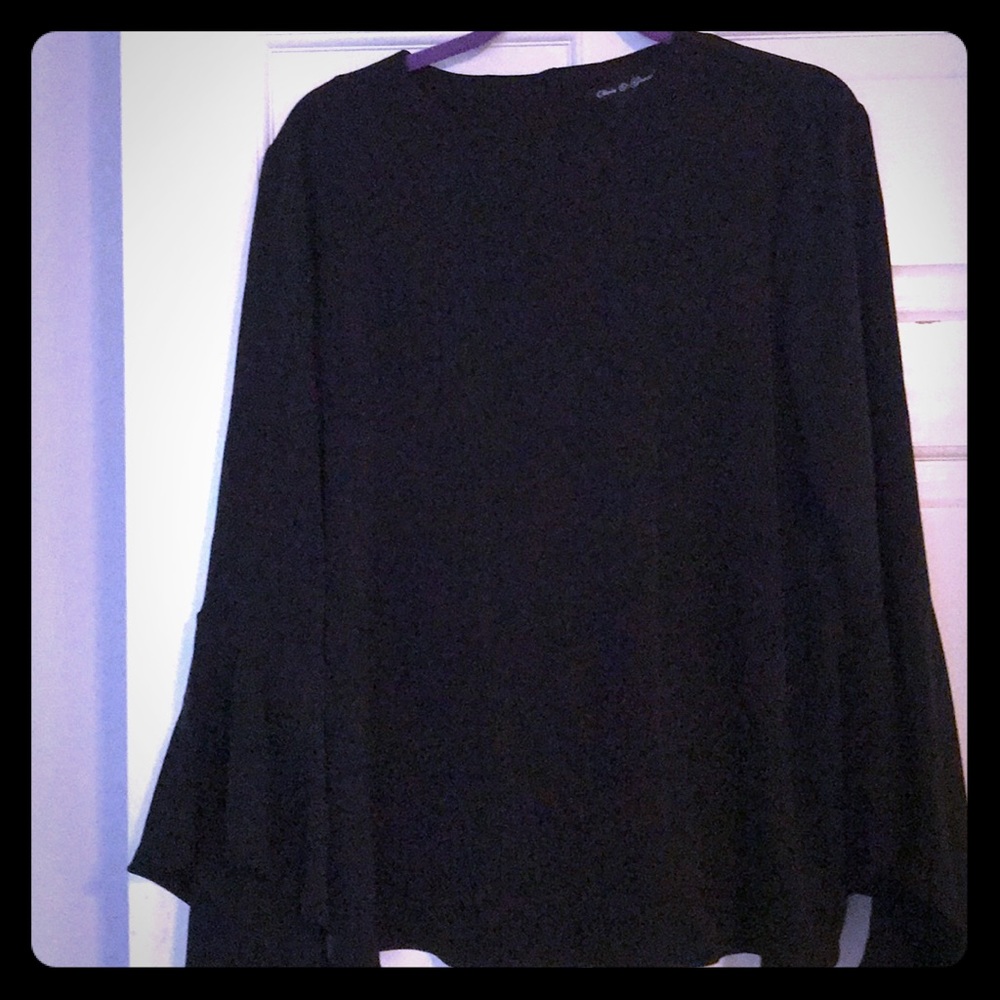 Black long sleeve blouse with button down back.